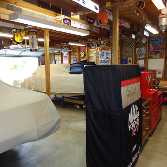 Organized garage with tool chests, car covers, and wall decor - theamcguy from Fayetteville, NC
