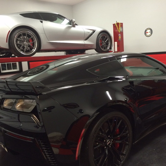Two Corvettes with Red Car Lift in Modern Garage - Bob from Brevard, NC