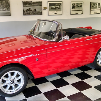 Classic red convertible in garage with checkered floor - Paul Wankle from Pleasanton, CA