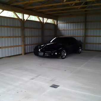Spacious metal garage with black sports car - mike zimmerman from New era, MI