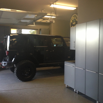 Modern garage with storage cabinets and Jeep - KT from Las Vegas, NV