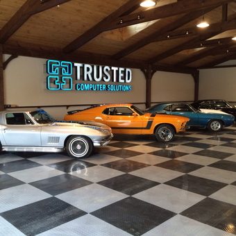 Classic Cars on Checkered Garage Floor with Wood Beams - Mike