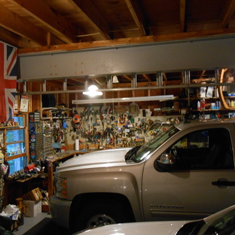 Organized garage with workbench, tools, and vehicles - Jeff from Boscawen, NH