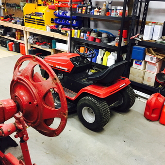 Organized garage with tool chest, storage shelves, and lawn tractor - Monte from Eugene, MO