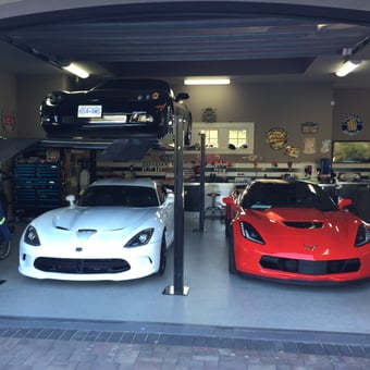 Organized garage with car lift, tool chests, and sports cars - cuzzy from Penticton, BC