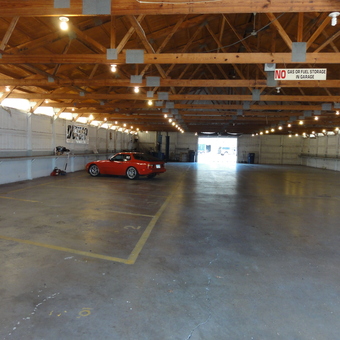 Spacious garage with red sports car and storage shelves - Doug from Kasson, MN