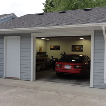 Organized garage with classic car, workbench, and wall art - Doug from Kasson, MN