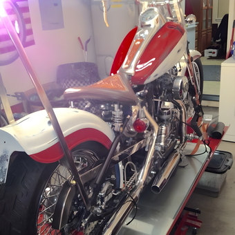 Classic Red and White Motorcycle on Lift in Garage - Oldharley from St Helens, Oregon