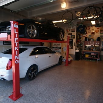Garage with Car Lift, Bicycles, and Wall Signs - Corve77e Guy from Calgary, Alberta