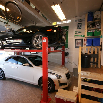 Garage with Car Lift, Wall Storage, and Signs - Corve77e Guy from Calgary, Alberta