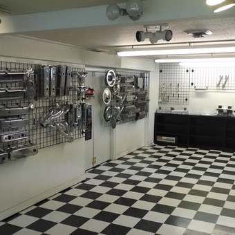 Chrome Engine Parts Display in Checkered Garage - diamond streetrodz from medford, Oregon
