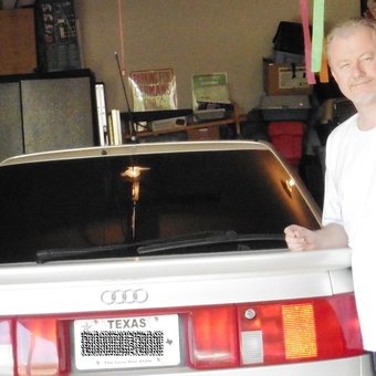 Organized garage with Audi and storage cabinets - Texas Audi owner from Murphy, TX
