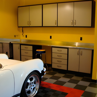 Modern garage with cabinets, workbench, and tile floor - Ian from Denver, CO
