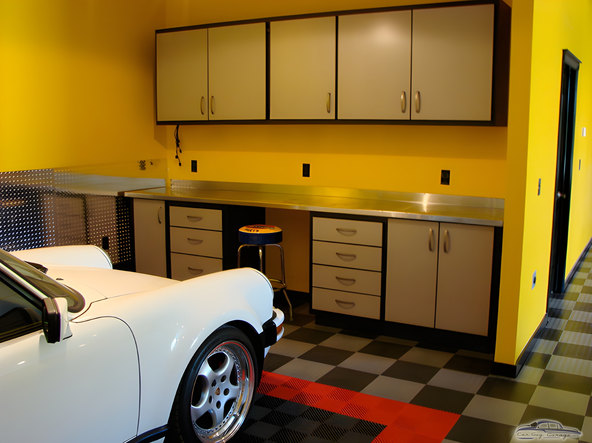 Modern garage with cabinets, workbench, and tile floor - Ian from Denver, CO