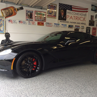 Black Corvette in Decorated Garage with Signs and Epoxy Floor - Rick from Canton, MI