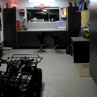 Organized garage workspace with cabinets and stools - Soaker of the dog from Surrey, British Columbia