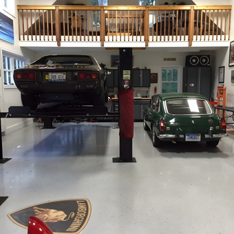 Classic Car Garage with Lift, Cabinets, and Decor - Trahan Carriage House from Rochester Hills, Michigan