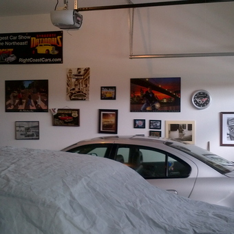 Garage with Wall Art, Car Memorabilia, and Covered Cars - Macs from Waterford, Ont.