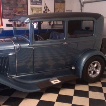 Classic Car Display With Checkered Floor and Wall Decor - Rusty from Lincoln, Ca
