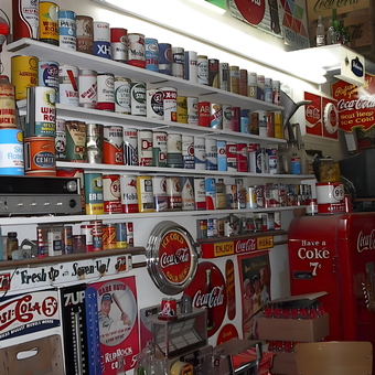 Vintage Oil Cans and Coca-Cola Decor in Garage - Johnny Ringo from Hafford, Sask.