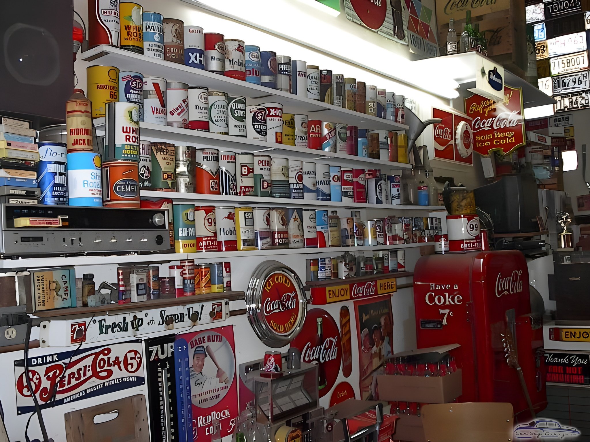 Vintage Oil Cans and Coca-Cola Decor in Garage - Johnny Ringo from Hafford, Sask.