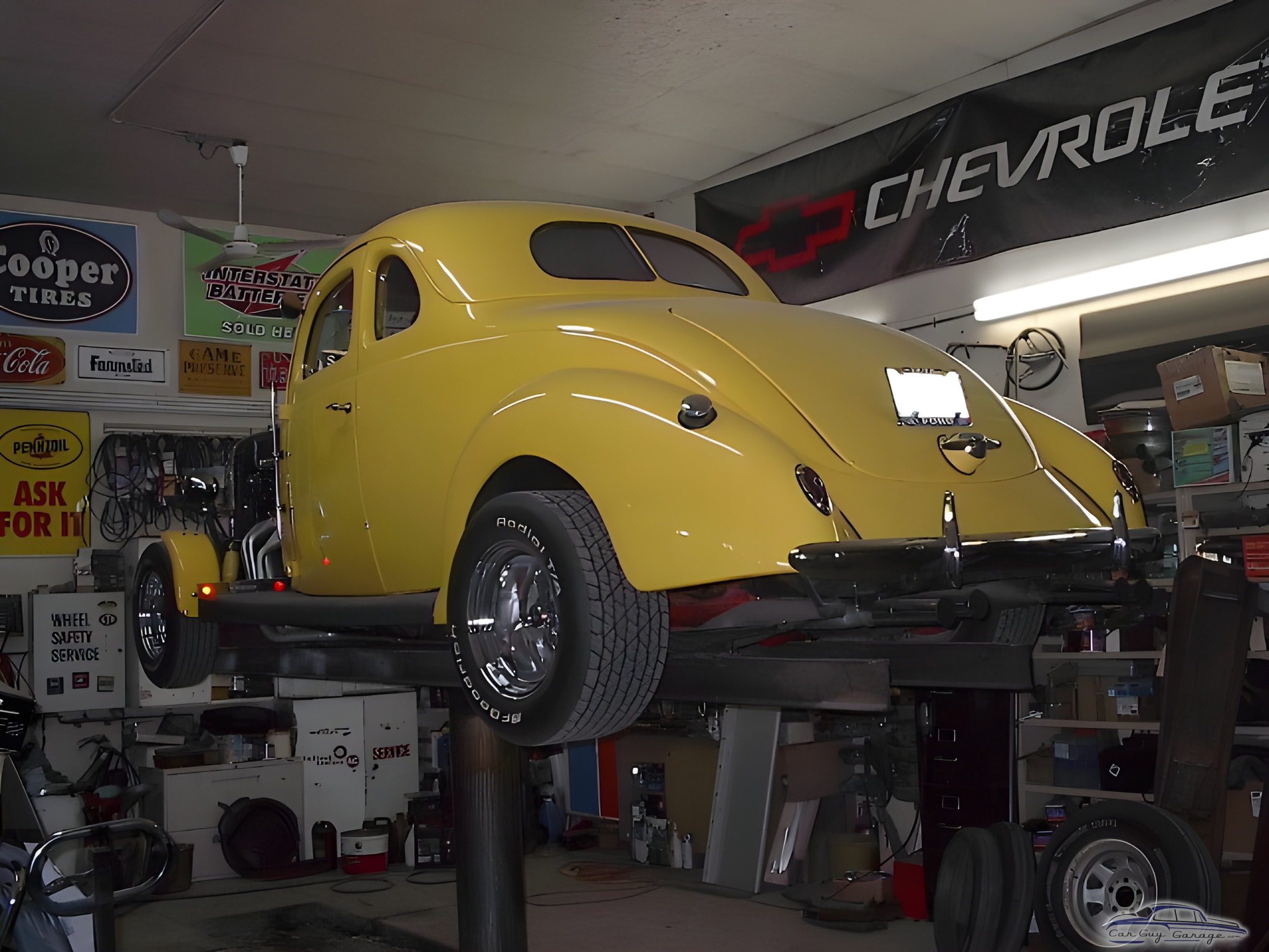 Classic Yellow Coupe on Lift in Organized Garage - Johnny Ringo from Hafford, Sask.