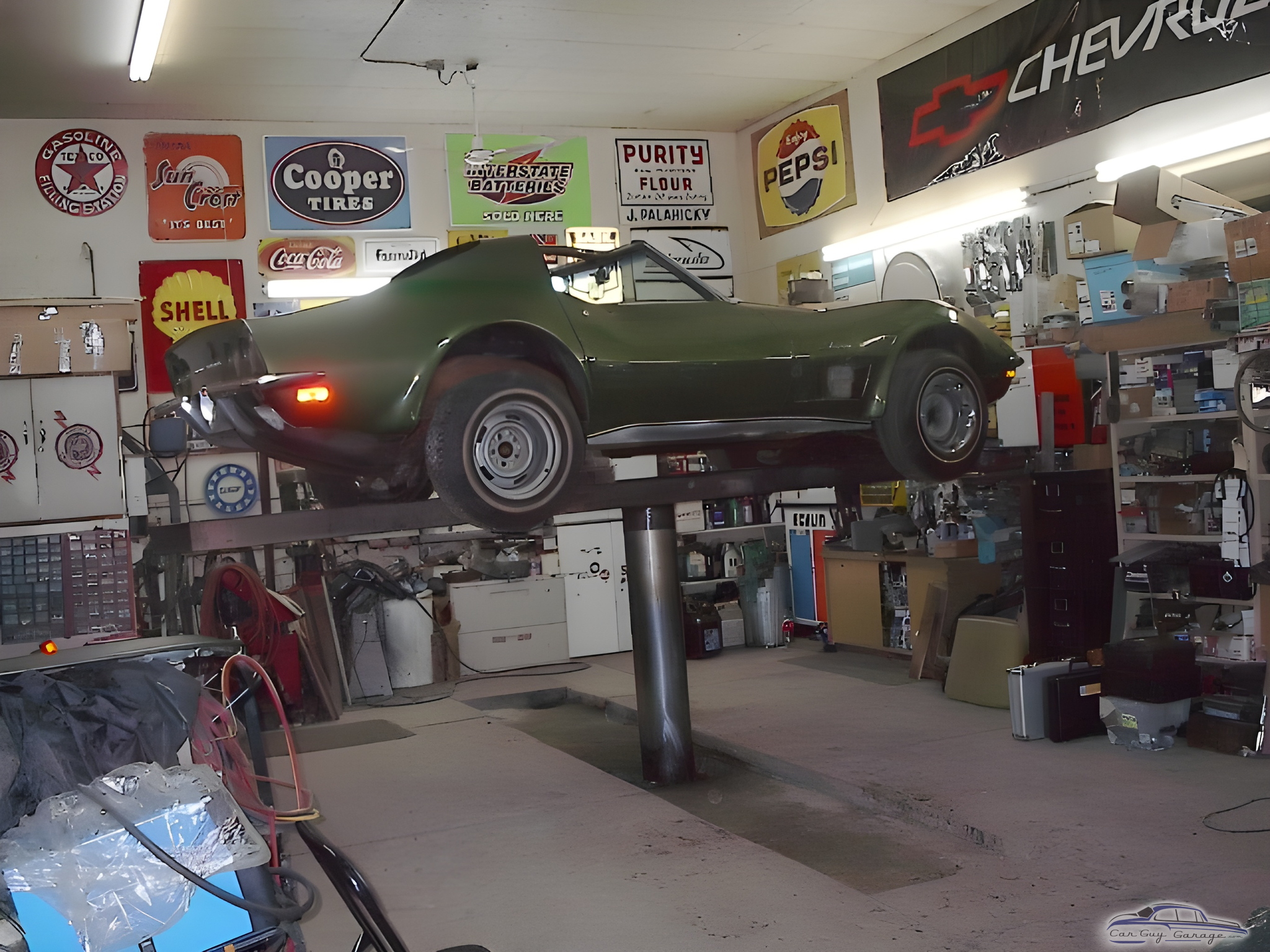 Classic Corvette on Hydraulic Lift in Organized Garage - Johnny Ringo from Hafford, Sask.