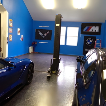 Blue sports cars in custom garage with car lift - Robert Scheer from Canyon Country, CA