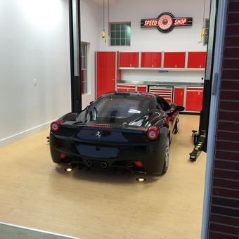 Modern garage with car lift and red cabinets - Joe from Crestview Hills, Kentucky