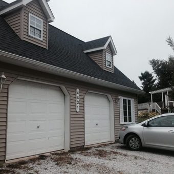 Double Garage with White Doors and Siding - Billie from Attica, Mi