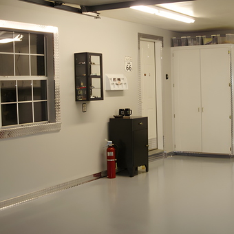 Organized garage with diamond plate trim and cabinets - Doug from Duncan, OK
