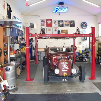 Classic Car Lift, Tools, and Neon Signs in Garage - Safari Joe from Sun City, Arizona
