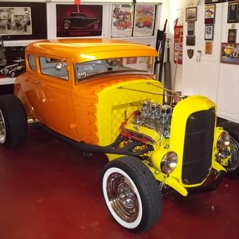 Classic hot rod display with wall art and cabinets - jim from El Cajon, CA
