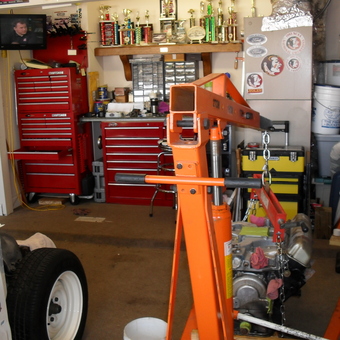 Organized garage with tool chests and engine hoist - Woods from Jacksonville, Fl