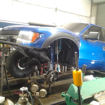 Blue Off-Road Truck Lifted in Garage Workshop - True Line Tony from El Cajon, California