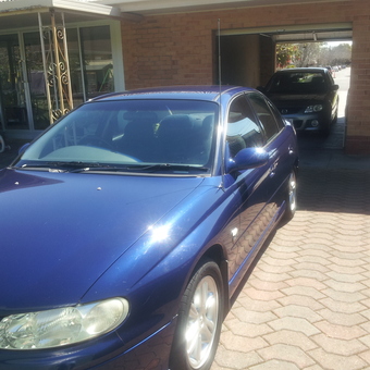 Blue Sedan Parked on Brick Driveway with Garage - gordonboyce98 from Fulham, South Australia