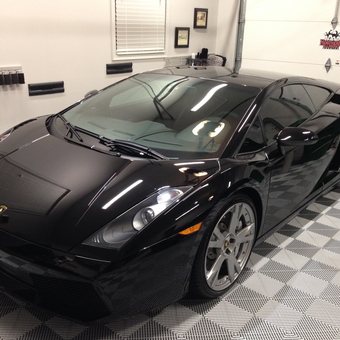 Luxury Garage with Black Sports Car and Organized Tools - Stunning Detail from Sycamore, IL