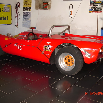 Red Race Car with Garage Decor and Tools - Anonymous