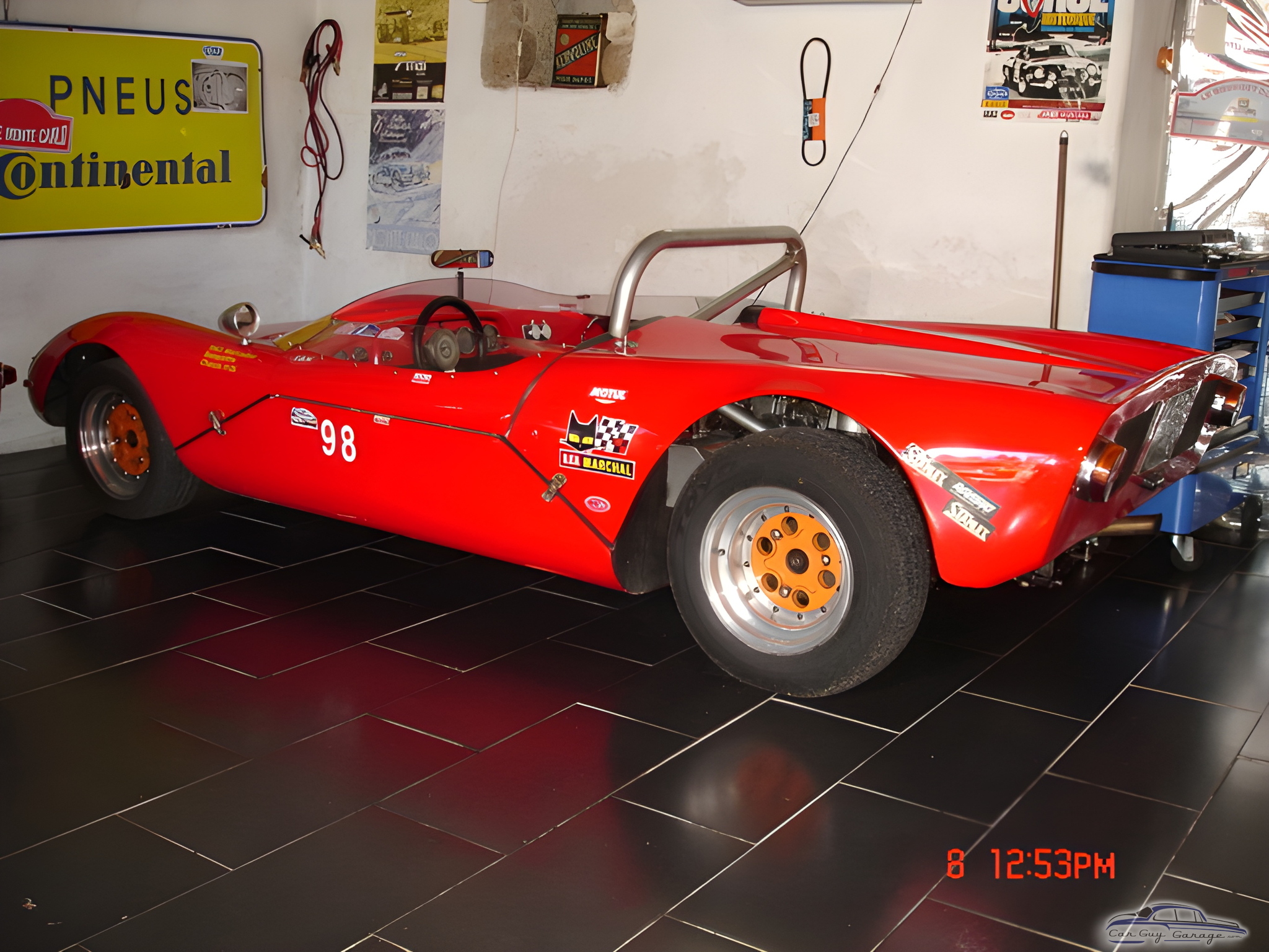 Red Race Car with Garage Decor and Tools - Anonymous