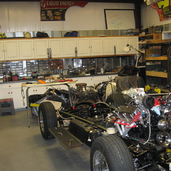 Organized garage workspace with car chassis and tools - Doug's Playroom from Myrtle Beach, South Carolina