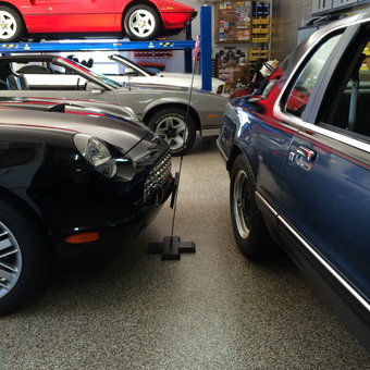 Organized garage with car lift, classic cars, and storage - Tom from belcarra, B.C.