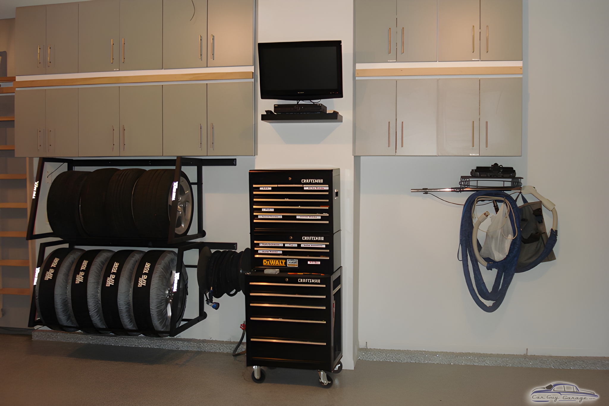 Organized garage with tire rack, tool chest, and cabinets - Scott from Lees Summit, MO