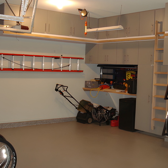 Organized garage with cabinets, tire rack, and ladder - Scott from Lees Summit, MO