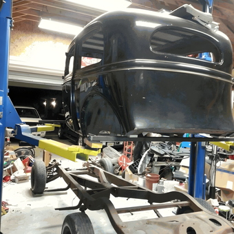 Classic Car Body on Lift in Busy Garage - james w sheffield jr from garden city, Georgia