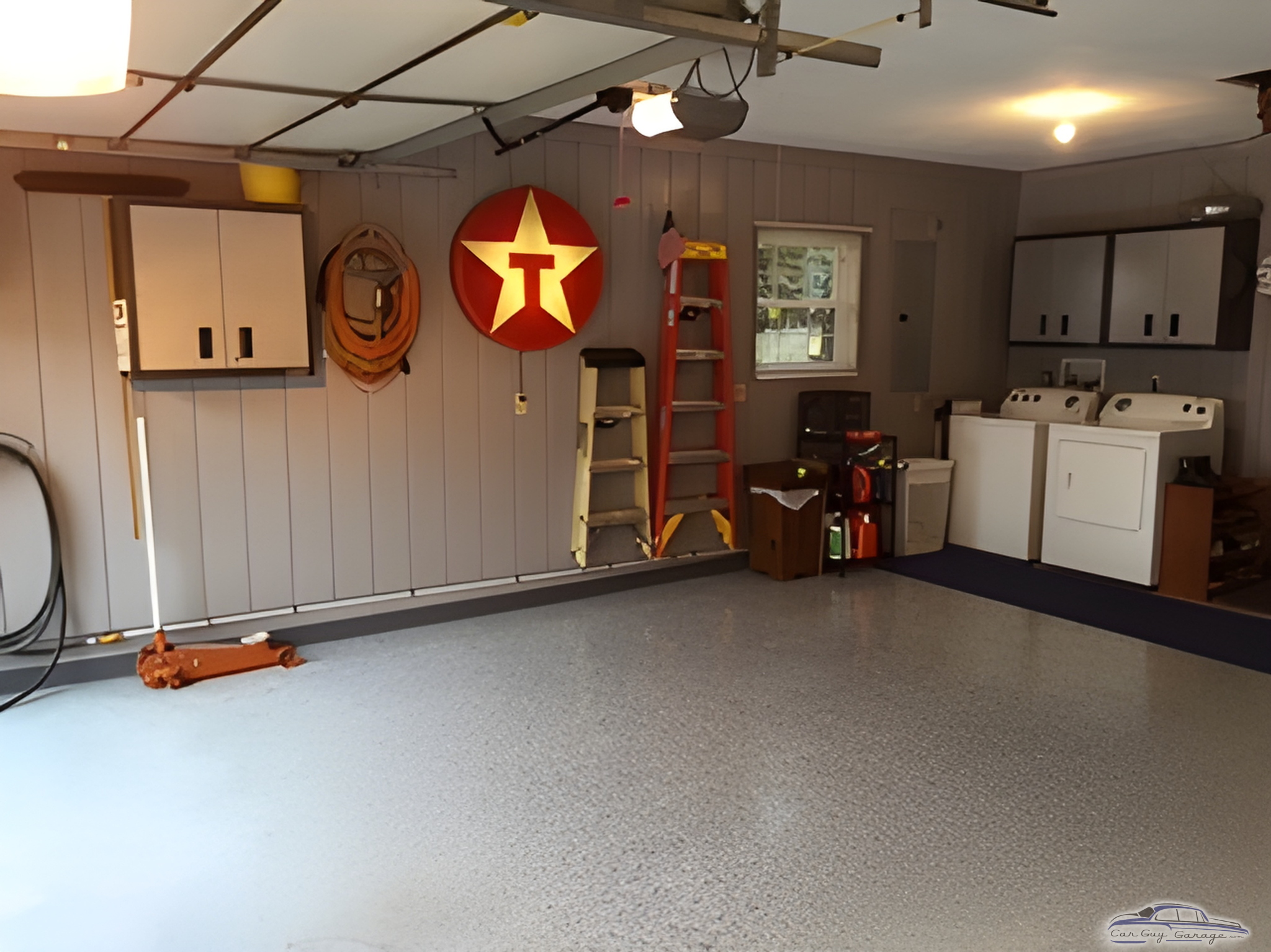 Organized garage with cabinets, Texaco sign, and washer dryer - Jerry from Millstadt, Il