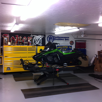 Organized garage with yellow tool chest and snowmobile lift - Larry from Weyauwega, WI