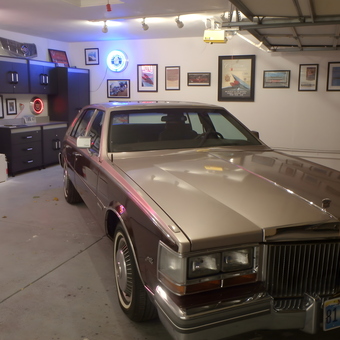 Classic Cadillac with Garage Cabinets and Neon Signs - Cad Woman from Las Vegas, NV
