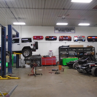 Organized garage with car lift, tool chests, and wall decor - Michael from Columbia Station, Ohio