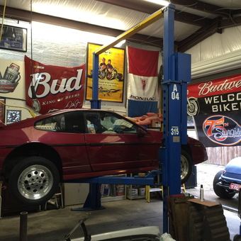 Classic Car on Lift with Automotive Signs - Terry from Edgewater, Fl