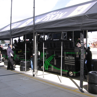 Racing Pit Garage With Tire Racks And Tool Cabinets - Anonymous